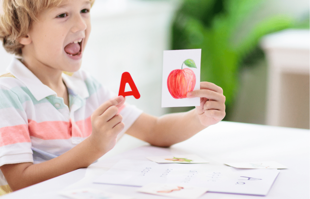 Student matching a with picture of an apple